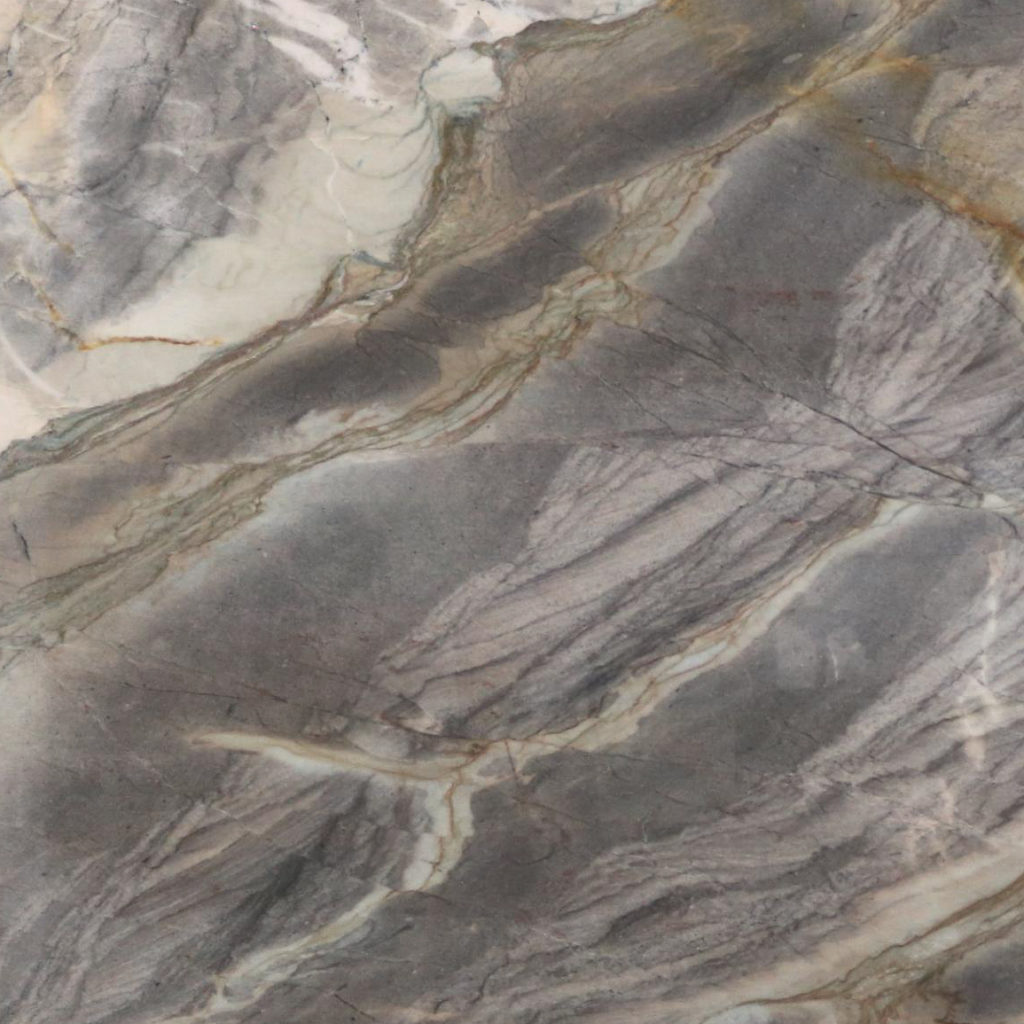 Quartzite is a metamorphic rock that began as sandstone. When exposed to tremendous pressure and heat, the individual sand grains in sandstone fuse together to create a dense rock consisting almost entirely of quartz.